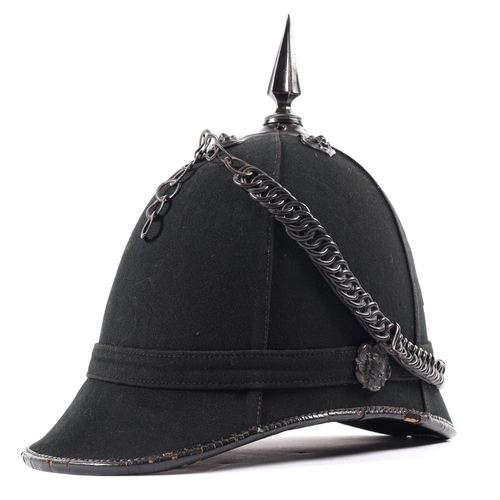 301 - A scarce Victorian OR's black home service helmet of the 1st Surrey Rifles, blackened mounts, lining... 