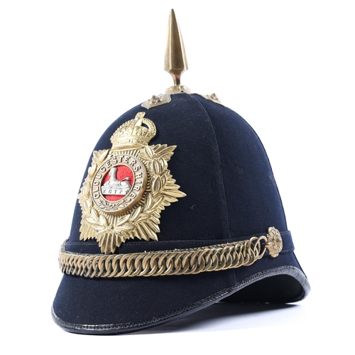 306 - A post 1902 ORs home service helmet to the Gloucestershire Regiment, blue cloth with brass mounts, r... 