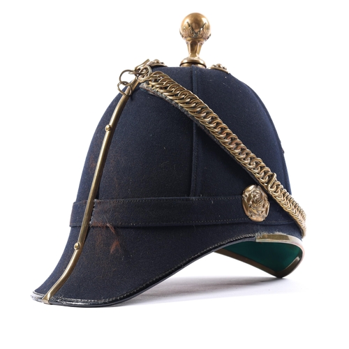 310 - A post 1902 officer's home service helmet of the Royal Army Medical Corps, blue cloth, brass mounts,... 