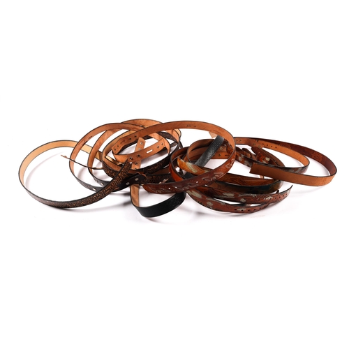 392 - A very large quantity of modern belt leathers, together with a very large quantity of decorative buc... 