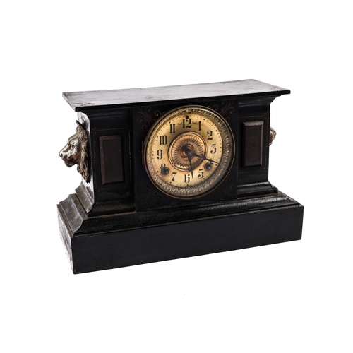 41 - A 19th century American mantel clock, of iron originally finished to imitate stone, now badly painte... 