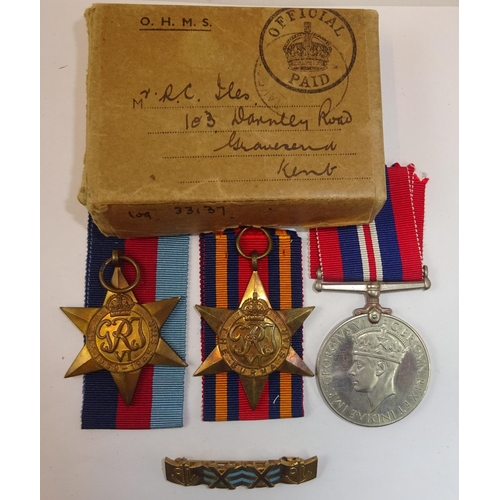 73 - Three: 1939-45 star, Atlantic star, War medal, un-named as issued, VF, in Navy carton remains named ... 