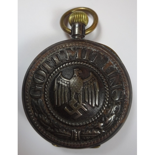 87 - A German Third Reich period pocket watch, with white dial, the steel case having affixed to the back... 