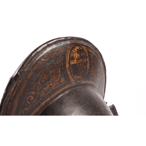 416 - A good German comb morion c 1600, formed in two halves, with brass rosettes around the base and bras... 