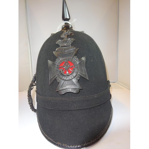 301 - A scarce Victorian OR's black home service helmet of the 1st Surrey Rifles, blackened mounts, lining... 