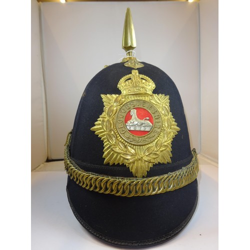 306 - A post 1902 ORs home service helmet to the Gloucestershire Regiment, blue cloth with brass mounts, r... 