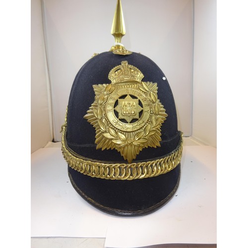 307 - A post 1902 OR's home service helmet of the East Surrey Regt, blue cloth with brass mounts, lining d... 