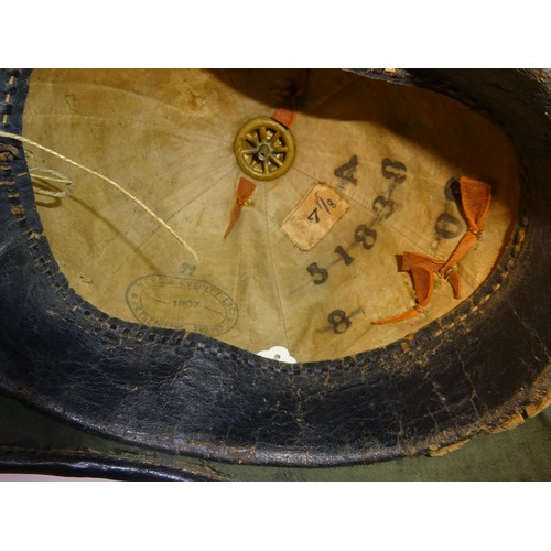 307 - A post 1902 OR's home service helmet of the East Surrey Regt, blue cloth with brass mounts, lining d... 