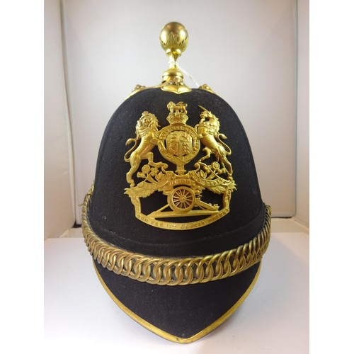 308 - A good post 1902 Officer's home service helmet of the Royal Artillery, blue cloth with gilt mounts, ... 