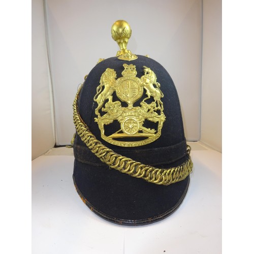 309 - A post 1902 OR's blue home service helmet to the Royal Field Artillery, brass mounts, marked inside ... 