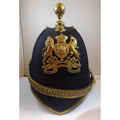 310 - A post 1902 officer's home service helmet of the Royal Army Medical Corps, blue cloth, brass mounts,... 