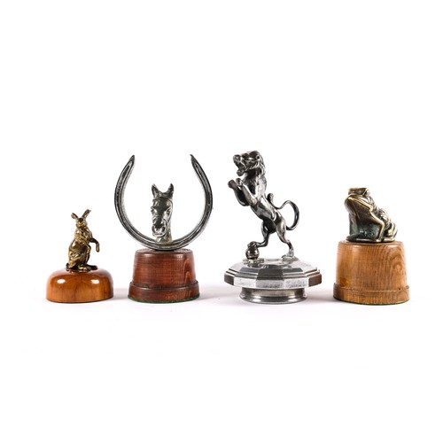 7 - 4 vintage car mascots. A plated horses head and shoe. A brass sitting frog. A brass standing Hare an... 