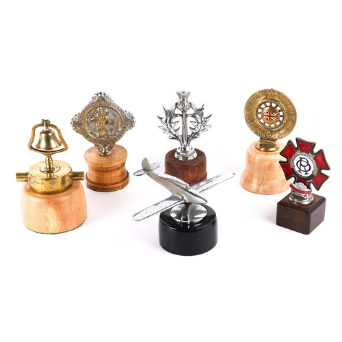 1 - 6 car mascots, bonnet ornaments. includes a chromed aeroplane, a thistle, a brass bell, Knight Grand... 