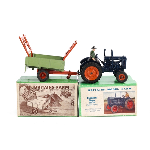 108 - A Britains Model Farm Fordson Major Tractor (rubber tyres) No.128F. In dark blue with orange wheels ... 