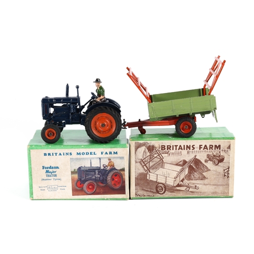 108 - A Britains Model Farm Fordson Major Tractor (rubber tyres) No.128F. In dark blue with orange wheels ... 