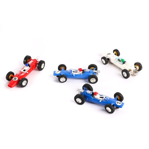 218 - 4 Scalextric F1 racing cars. 2x Lotus in blue with driver, numbered 1 and 2, together with 2x Cooper... 