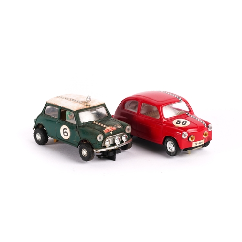 221 - 2 Scalextric cars, Fiat T.C. 600 in red with racing No.30, together with a Mini Cooper in green with... 