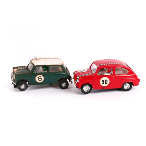 221 - 2 Scalextric cars, Fiat T.C. 600 in red with racing No.30, together with a Mini Cooper in green with... 