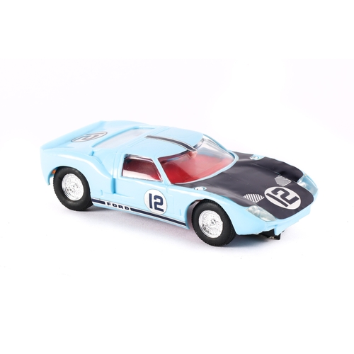 222 - A scarce Scalextric Ford GT 40 in light blue. Has decals No.12 on doors, bonnet and boot, This is pr... 