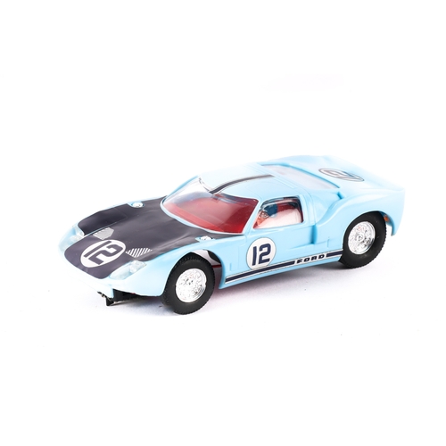 222 - A scarce Scalextric Ford GT 40 in light blue. Has decals No.12 on doors, bonnet and boot, This is pr... 