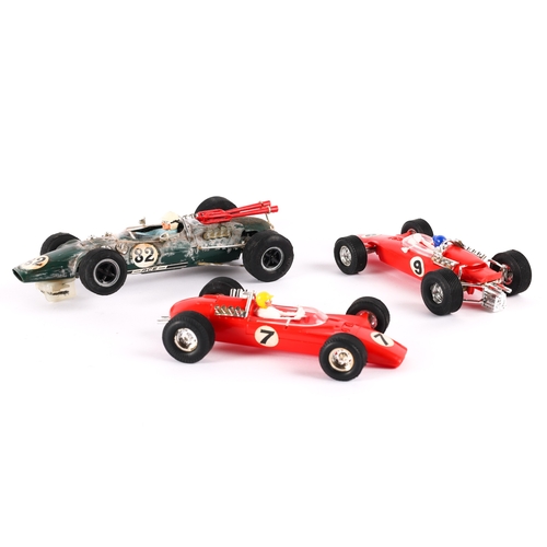 224 - A scarce Scalextric super 124 Lotus F1 car  in green with  No.82 decals with driver in light blue wi... 