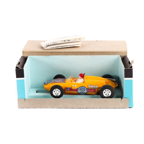 247 - A Hoffenhauser  rear engine racing car in yellow with driver. Contained in its original brown card o... 