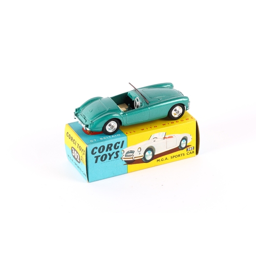 330 - Corgi Toys M.G.A. Sports car (302). A late example in metallic green with cream seats, screen and si... 