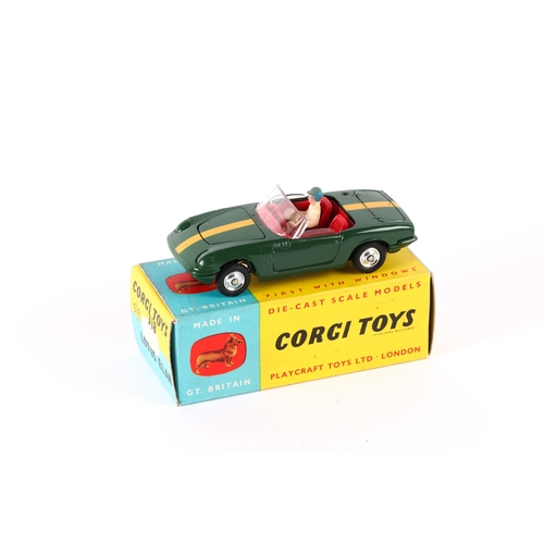 332 - Corgi Toys Lotus Elan (318). An example in dark green with yellow stripe and red interior, complete ... 