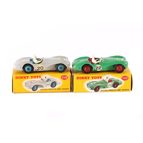 389 - 2 Dinky Toys Aston Martin DB3 Sports (110). One in green, RN22 with red interior and wheels. Plus an... 