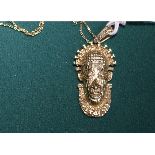 39 - A 18K gold hallmarked chain, with a Tribal looking head pendant, also stamped 18K, very well cast. p... 