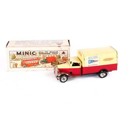 430 - A Tr-ang Minic Post War British Railways Van 107M. In red and cream livery, tinplate wheels with bla... 