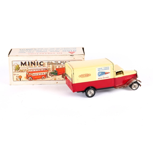 430 - A Tr-ang Minic Post War British Railways Van 107M. In red and cream livery, tinplate wheels with bla... 