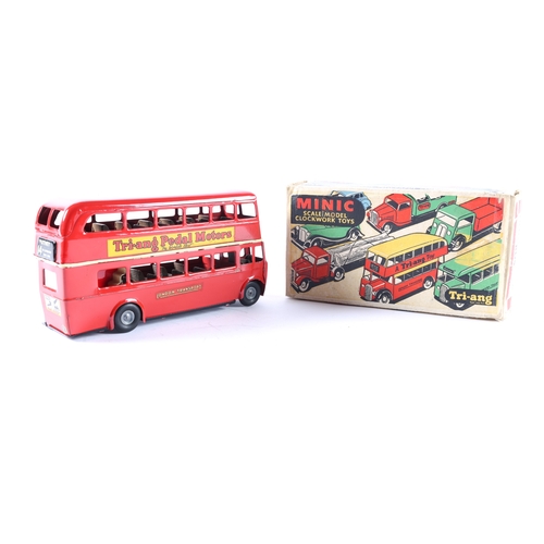 438 - A Post War Tri-ang Minic clockwork powered double decker bus 60M IV. An example in red London Transp... 