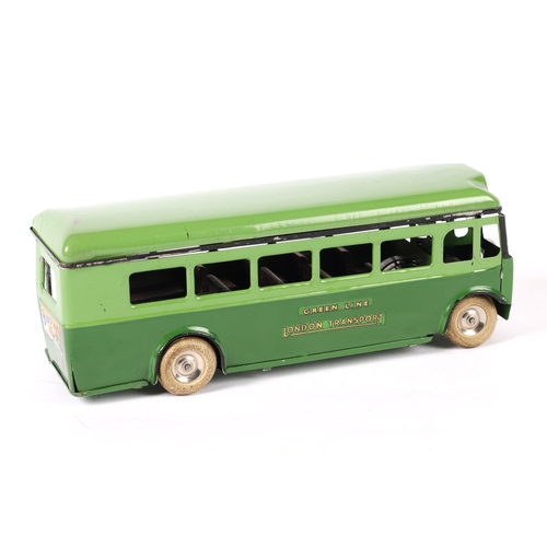 439 - An early issue Tri-ang Minic clockwork powered single deck bus 52M. An example in two tone green Gre... 