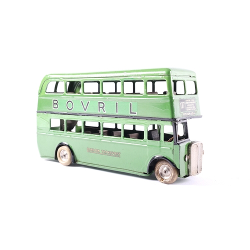 446 - A scarce early issue Tri-ang Minic clockwork powered double decker bus.60M. An example in two tone g... 