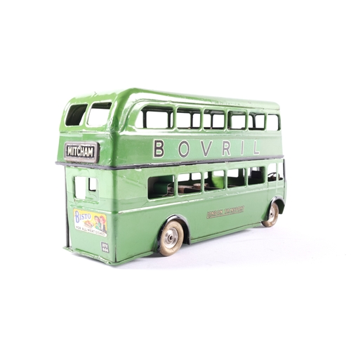 446 - A scarce early issue Tri-ang Minic clockwork powered double decker bus.60M. An example in two tone g... 