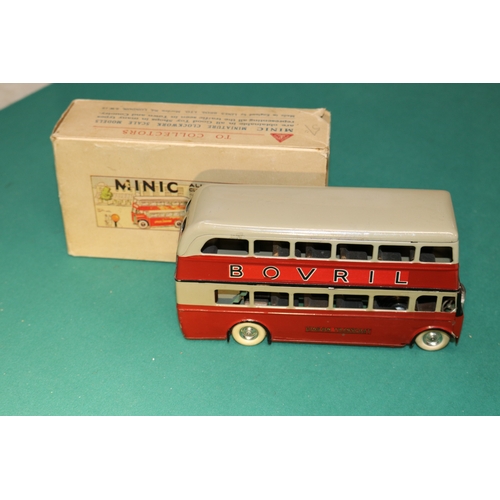 447 - A scarce early issue Tri-ang Minic clockwork powered double decker bus 60M. An example in maroon and... 