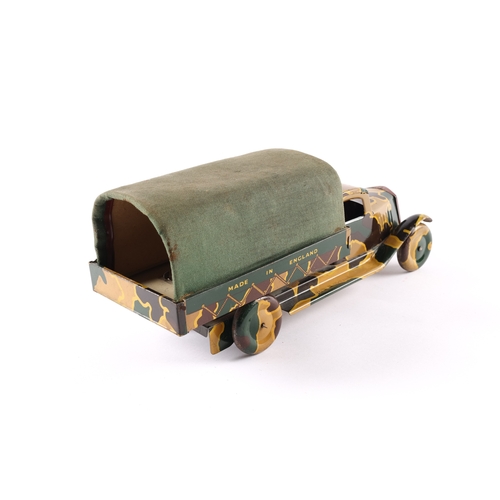 452 - A scarce Wells tinplate clockwork military lorry. Finished in 3 colour camouflage, dark green, beige... 