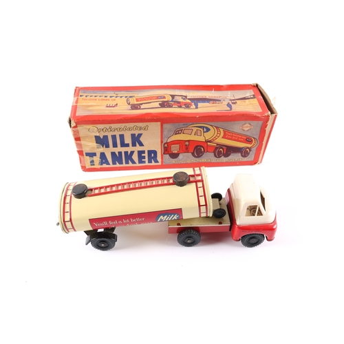 454 - A Wells Brimtoy Bedford 'S' type articulated Milk Tanker. A larger example, 26cm overall length. Bri... 