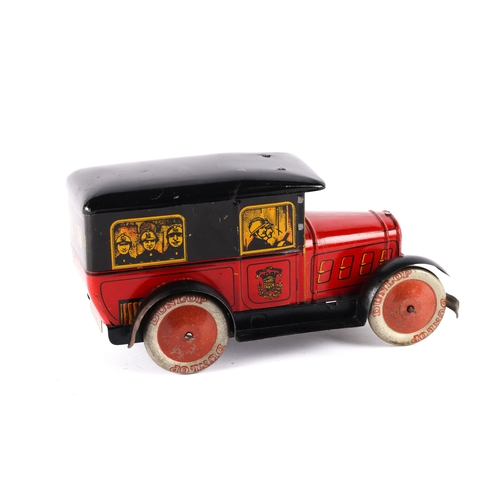 465 - A French S.P. tinplate clockwork Fire Brigade Vehicle. In red, black and yellow with litho detailing... 