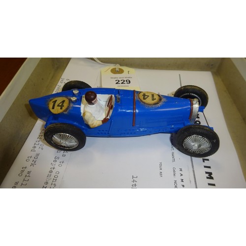 229 - An extremely scarce Scalextric 1934 Bugatti in blue with driver. Contained in its original slide out... 