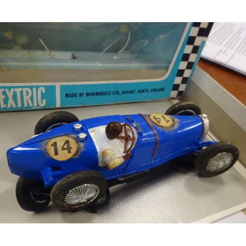 229 - An extremely scarce Scalextric 1934 Bugatti in blue with driver. Contained in its original slide out... 