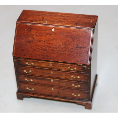 18 - A very impressive miniature wooden Bureau in the early Victorian style, Has an opening flap that can... 