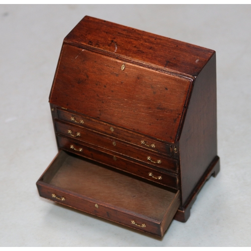 18 - A very impressive miniature wooden Bureau in the early Victorian style, Has an opening flap that can... 