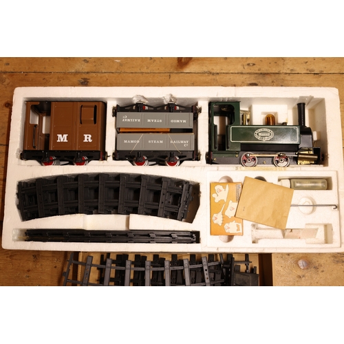 194 - 'The Mamod Steam Railway Co' Train set. Comprising of a live steam 0-4-0 tank locomotive painted in ... 