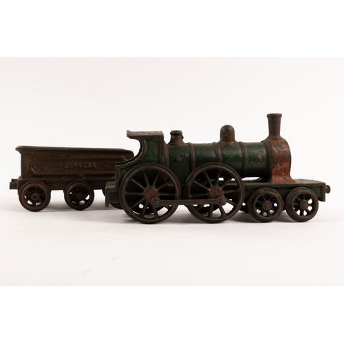 195 - A Henry Woolwork & Co, cast iron locomotive with tender and 3 coaches. dating from the late 19th cen... 