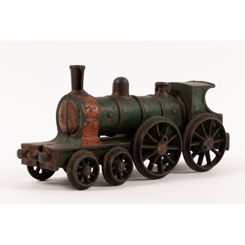 195 - A Henry Woolwork & Co, cast iron locomotive with tender and 3 coaches. dating from the late 19th cen... 