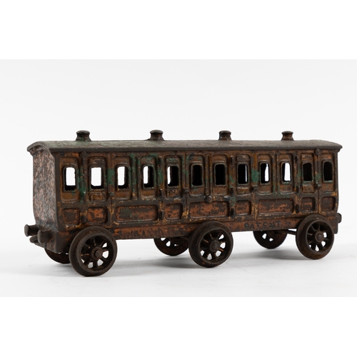 195 - A Henry Woolwork & Co, cast iron locomotive with tender and 3 coaches. dating from the late 19th cen... 