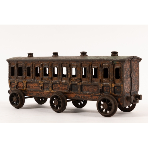 195 - A Henry Woolwork & Co, cast iron locomotive with tender and 3 coaches. dating from the late 19th cen... 