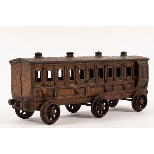 195 - A Henry Woolwork & Co, cast iron locomotive with tender and 3 coaches. dating from the late 19th cen... 